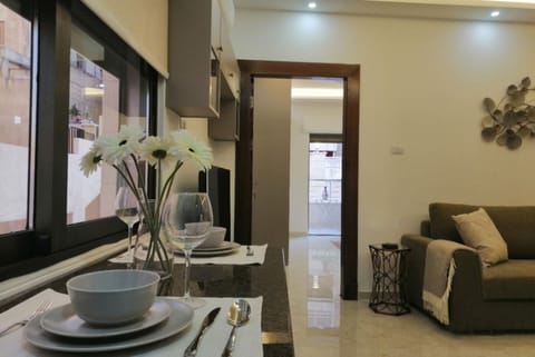 Apartment | Living area | 30-inch TV with satellite channels