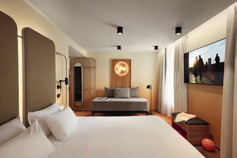 Premium bedding, laptop workspace, blackout drapes, soundproofing