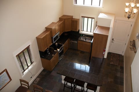 View of the breakfast bar and kitchen from the loft