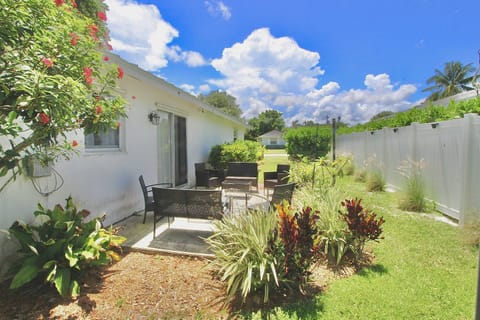 Relax in the backyard gardens with seating for 6-8 people…