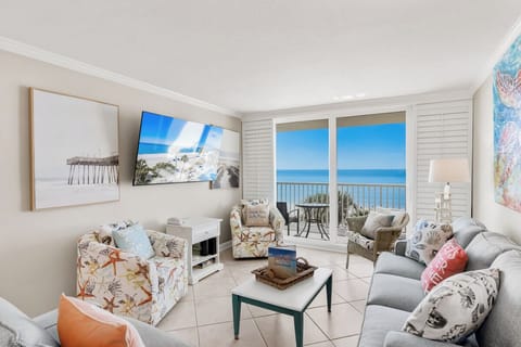 Sink into your oceanfront living room where panoramic sea views and coastal breezes create your perfect beachside retreat.