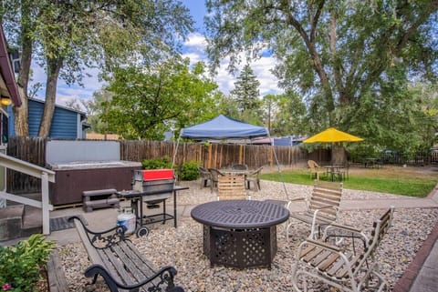 Gather around the backyard fire table with plenty of seating—an easy setup for evening chats under the trees.