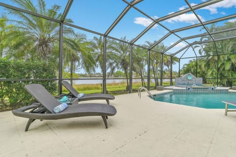 VILLA MARGARETHA - Private heated pool with waterfall, covered outdoor seating and dining area, lounge area and BBQ Grill complete the large screened lanai.