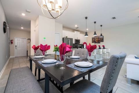 Host memorable meals in this elegant dining area, featuring contemporary decor, plush seating, and a chic modern vibe perfect for gatherings!