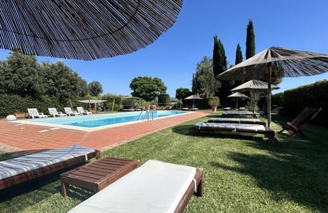 Seasonal outdoor pool, open 9:00 AM to 7:00 PM, pool umbrellas