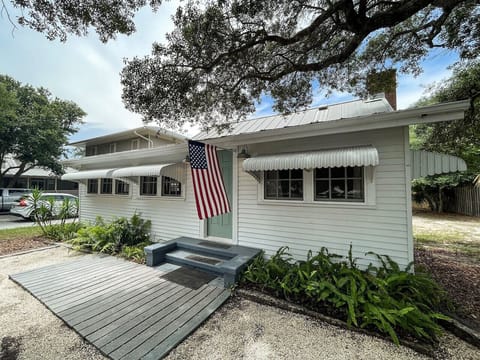 Historic charm awaits in this single story home that is just steps from the beach