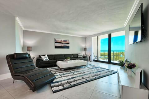 With the long leather couch and chaise lounge, the living room offers ample seating.