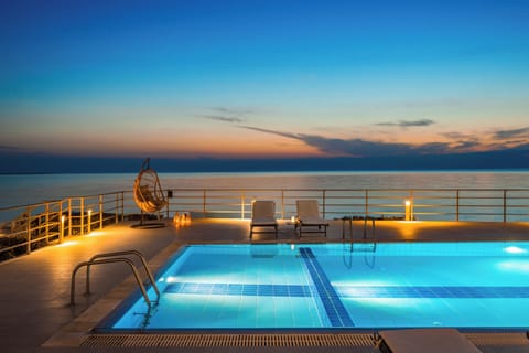 Outdoor pool, open 8:00 AM to 9:00 PM, pool umbrellas, sun loungers