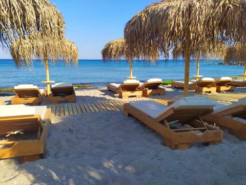 Private beach nearby, white sand, sun loungers, beach umbrellas