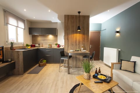 Deluxe Duplex | Living area | 50-cm flat-screen TV with cable channels, TV