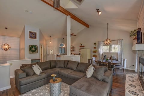 Upper living area, kitchen, dining room, living room, fireplace.