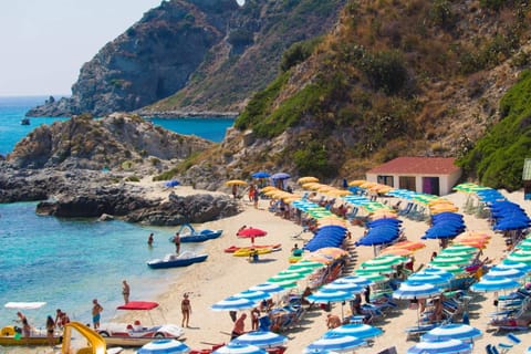 Private beach, white sand, free beach shuttle, beach umbrellas