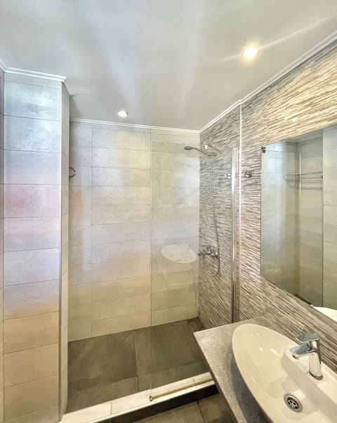 Shower, towels, soap, toilet paper