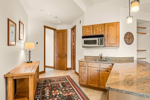 Bottom level fully-enclosed apartment with kitchenette