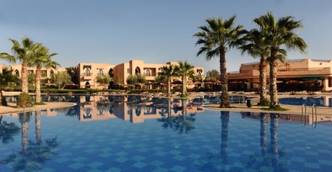 2 outdoor pools, open 10:00 AM to 6:00 PM, pool umbrellas