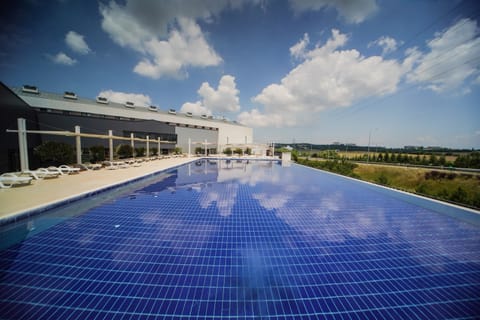 Seasonal outdoor pool, open 10:00 AM to 7:00 PM, sun loungers
