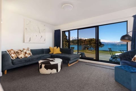 Entertainment lounge, with open flow dining area, kitchen and private balcony.