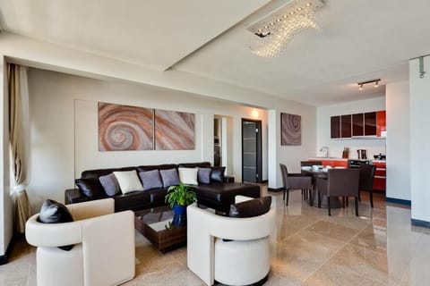 Luxury Suite, Sea View (Tanzanite) | Living area | Flat-screen TV
