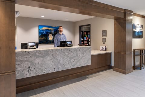 Front desk lobby with reception staff on duty.