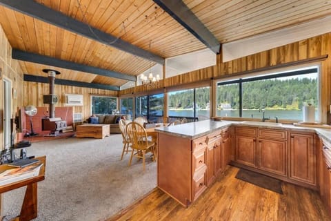 Open concept kitchen and dining area leading to living room