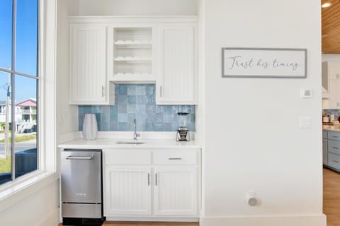 Wetbar off kitchen with one of two under counter ice makers.