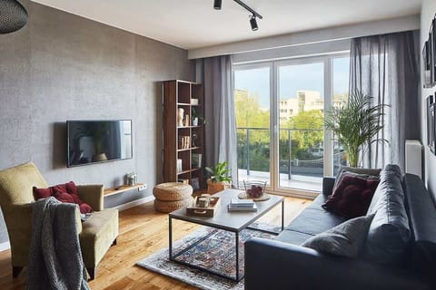 Living room with a comfortable sofa and TV. 
