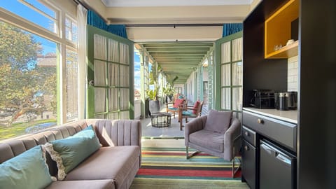 Premium Suite, 1 King Bed | Living area | Flat-screen TV