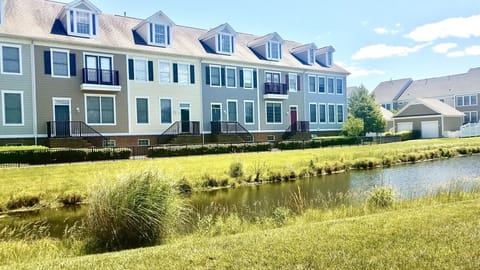 Front of home with pond views