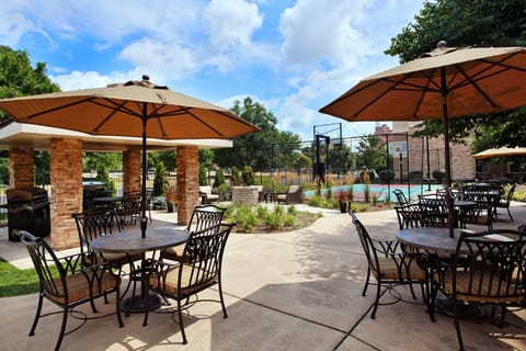 Relax under the shade of stylish umbrellas while enjoying a meal outdoors.