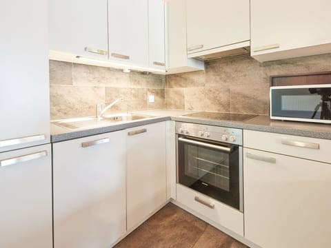 Cabinetry, Countertop, Property, Furniture, Building, Kitchen Stove, Kitchen Appliance, Kitchen, Home Appliance, Wood