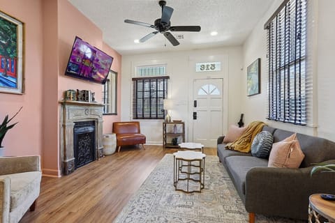 Comfortable living space with fold down sofa and smart TV.