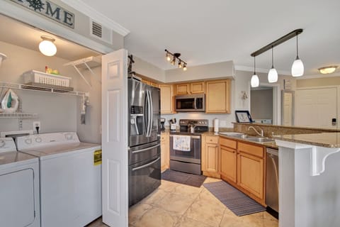 Kitchen w/ full size washer and dryer