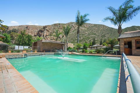 4 outdoor pools, open 8:00 AM to 10:00 PM, pool umbrellas, sun loungers
