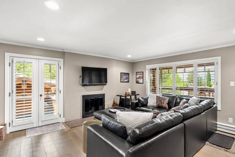 The living room is updated with a new sectional sofa, flat screen TV and gas fireplace for your enjoyment.