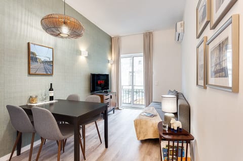 Living Room: Equipped with a Sofa bed, Smart TV, Table for dining and Air Conditioning