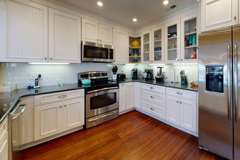 The kitchen has updated appliances, counters, kitchenware and cabinets. Everything you need to cook & eat during your stay!