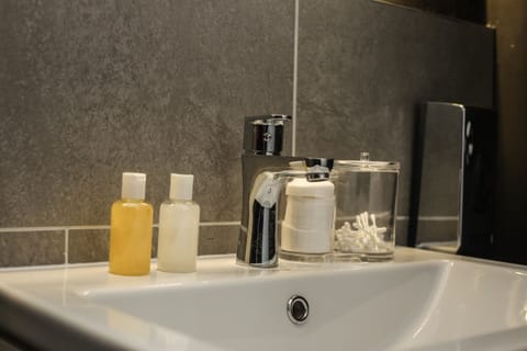 Shower, free toiletries, hair dryer, slippers