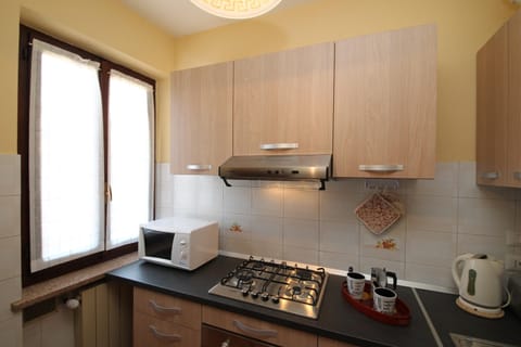 Family Apartment, Multiple Bedrooms (Sunset in Baveno) | Private kitchen | Full-size fridge, microwave, oven, stovetop