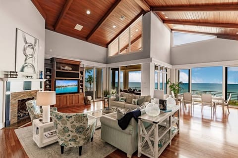 Spacious open-concept living room with stunning Gulf-front views