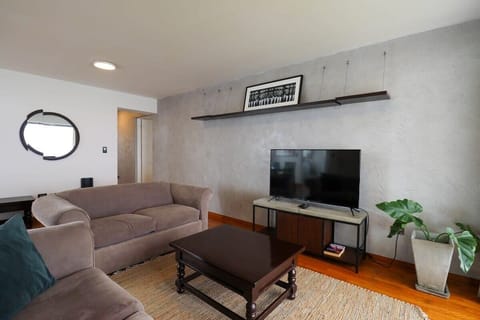 Modern Living Room with Smart TV and Minimalist Decor
