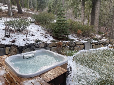Hot tub on back deck overlooking mountains & creek (sometime surrounded by snow)