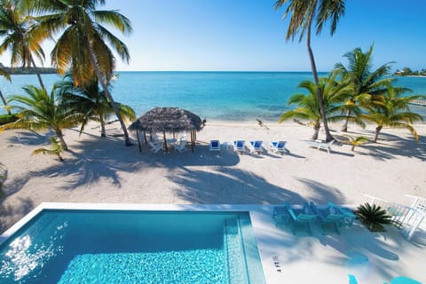 Bit of Heaven is a 3-bedroom home with a brand new pool and a wide backyard beach.