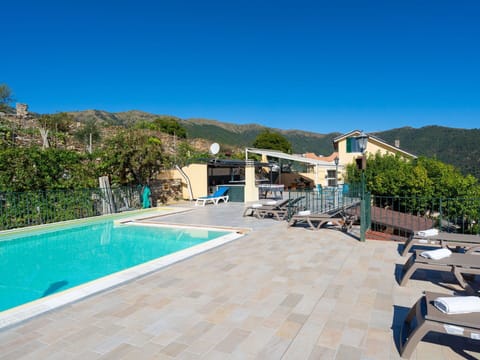 Water, Sky, Furniture, Building, Plant, Swimming Pool, Chair, Azure, Shade, Outdoor Furniture