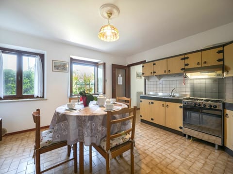 Furniture, Cabinetry, Table, Countertop, Window, Chair, Interior Design, Wood, Lighting, Kitchen