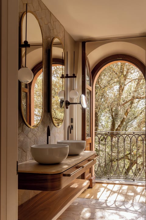 Suite | Bathroom | Designer toiletries, hair dryer, bathrobes, slippers