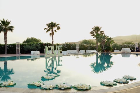 Seasonal outdoor pool, open 9:00 AM to 6:00 PM, pool umbrellas
