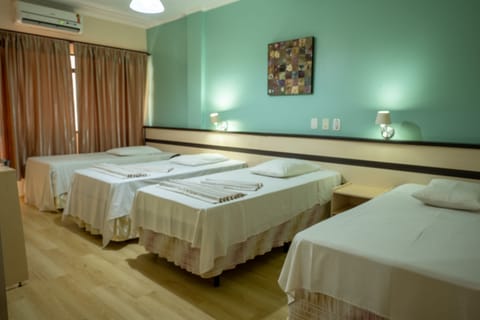Standard Quadruple Room | Minibar, in-room safe, desk, blackout drapes