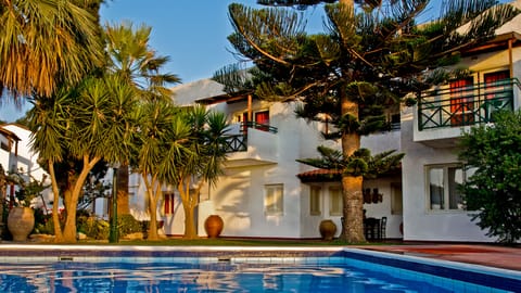 Seasonal outdoor pool, open 9:00 AM to 6:00 PM, pool umbrellas
