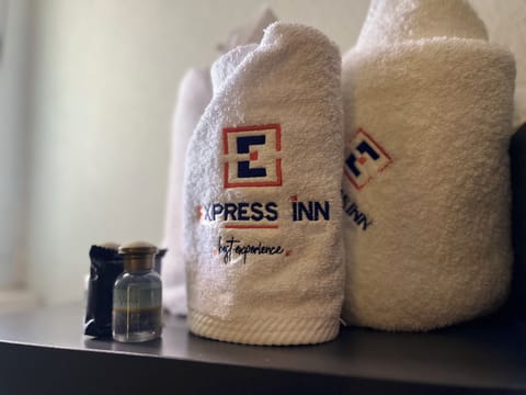 Deluxe Room, 2 Queen Beds | Bathroom | Shower, rainfall showerhead, designer toiletries, towels