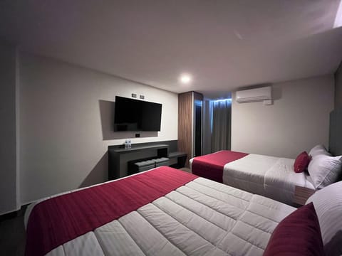 Deluxe Room, 2 Queen Beds | Desk, laptop workspace, free WiFi, bed sheets